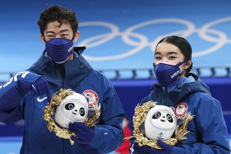 US skaters to get Olympic torches as medals wait